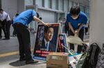 Campaign workers prepare a poster of Japanese Prime Minister Fumio Kishida in Yokohama.