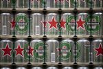 Red star logos sit on Heineken beer cans at the Heineken NV brewery in Zoeterwoude, Netherlands.