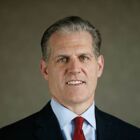 Headshot of Dean C Athanasia