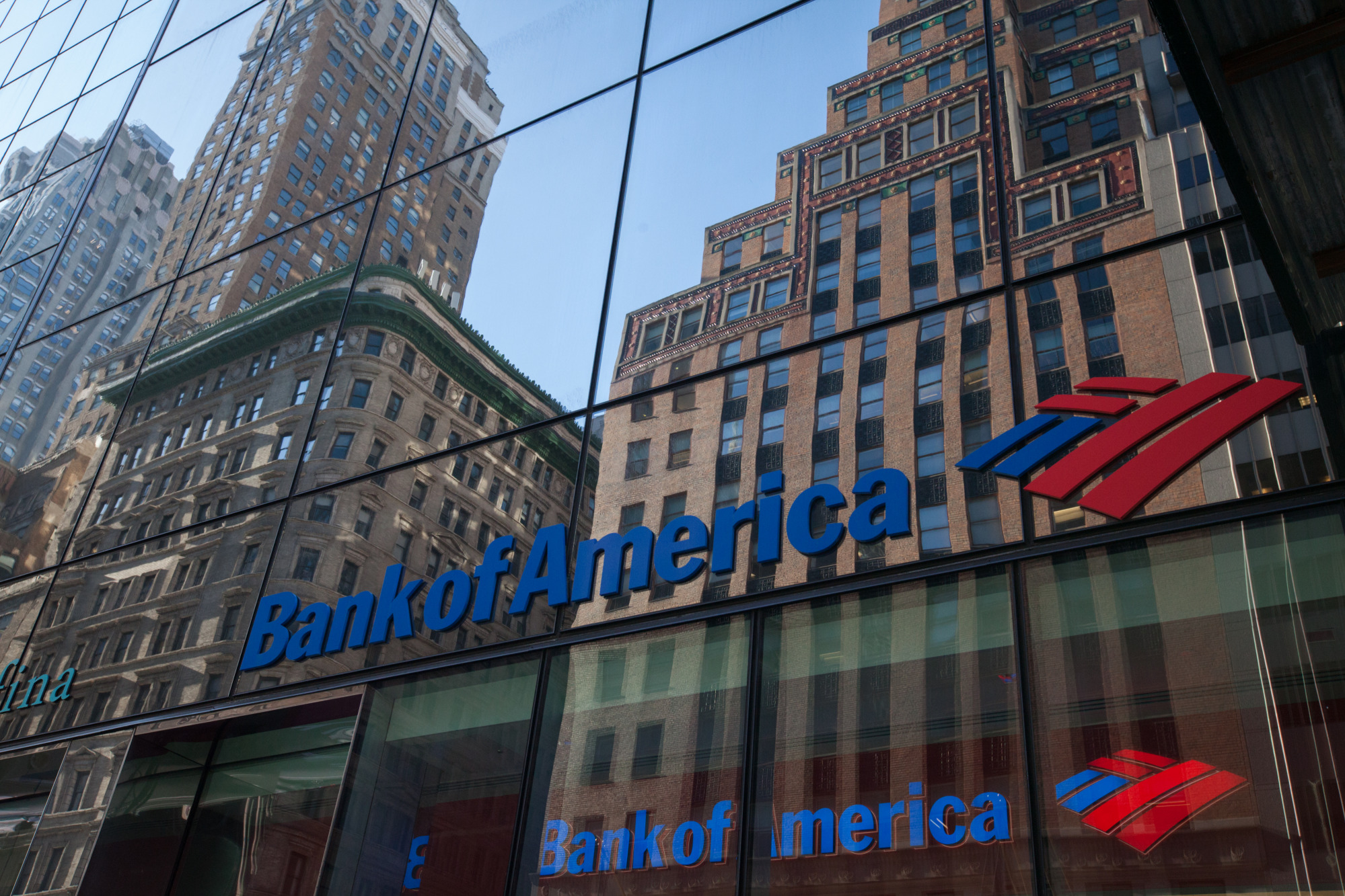 Building are seen reflected on a Bank of America Corp. branch in New York.
