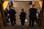 New York Police Department&nbsp;officers patrol a subway station&nbsp;in the Brooklyn borough of New York.