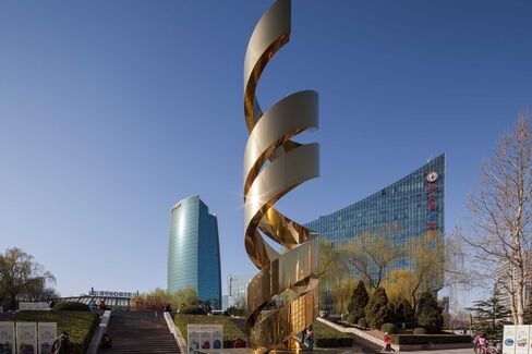 The E-Plaza building, at right, houses offices for startups above a disused shopping mall in Beijing's Zhongguancun neighborhood.