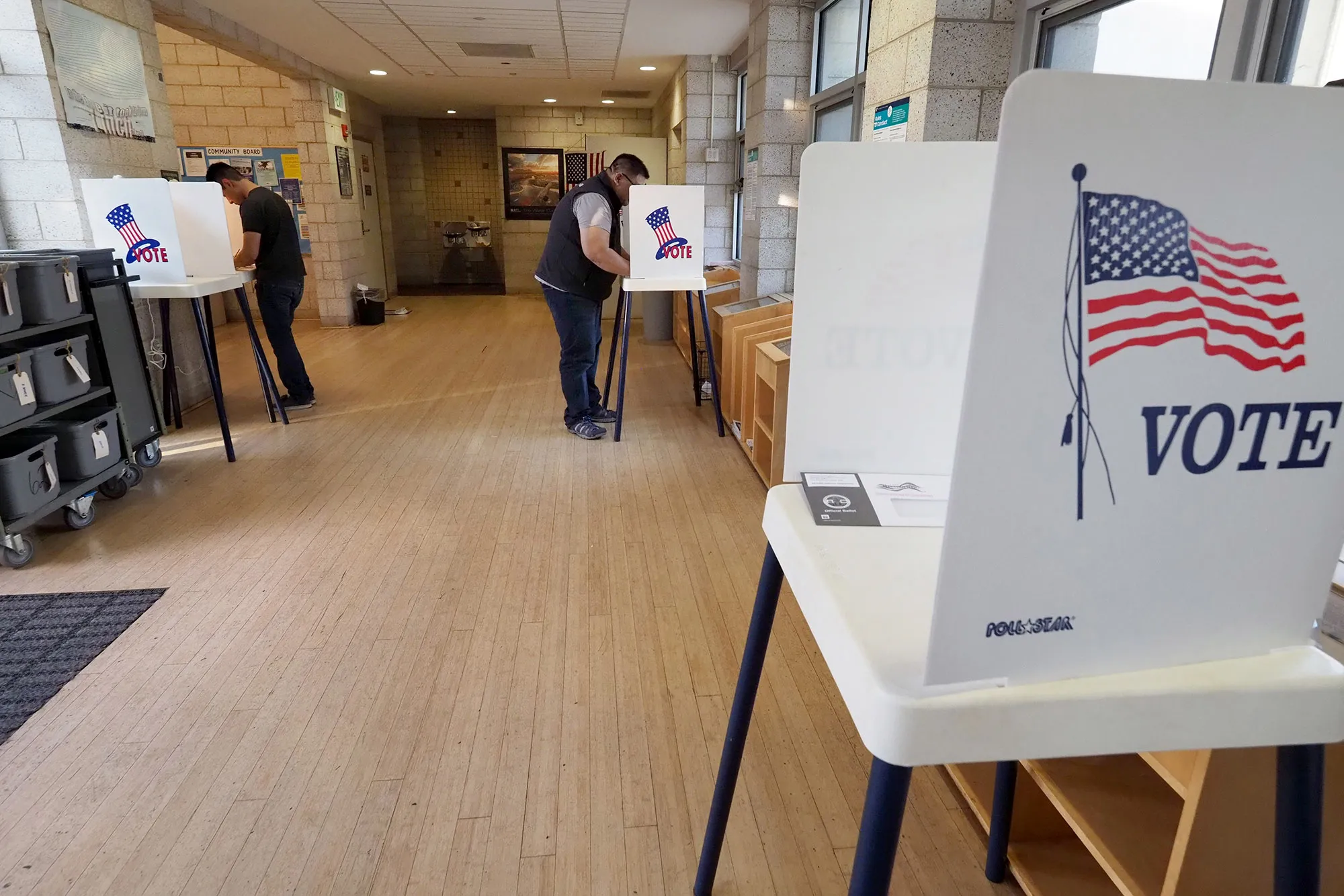 People complete their ballot during early voting at a&nbsp;library in the Lake View Terrace neighborhood of Los Angeles.