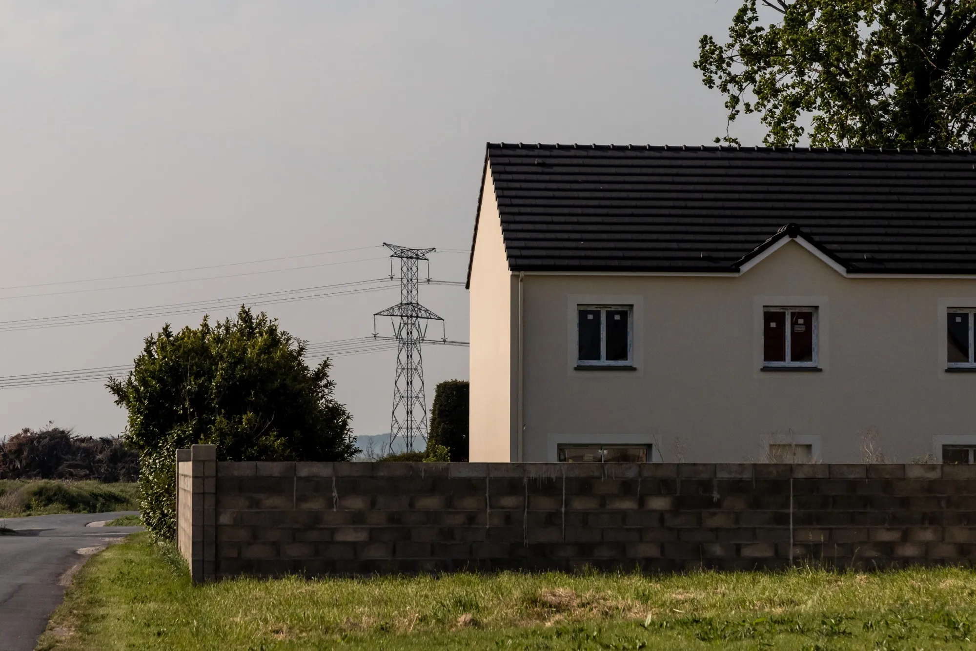 High voltage power lines near housing in Laas, France.