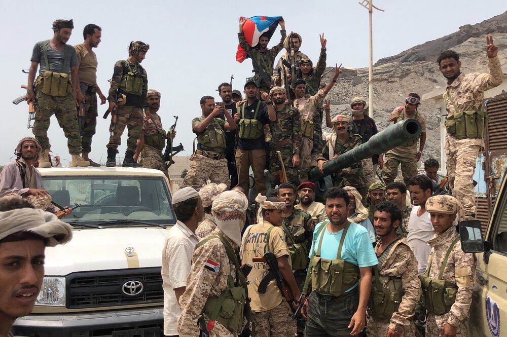 Yemeni supporters of the southern separatist movement pose for a picture in Khor Maksar, in Aden on Aug.Â 10.
