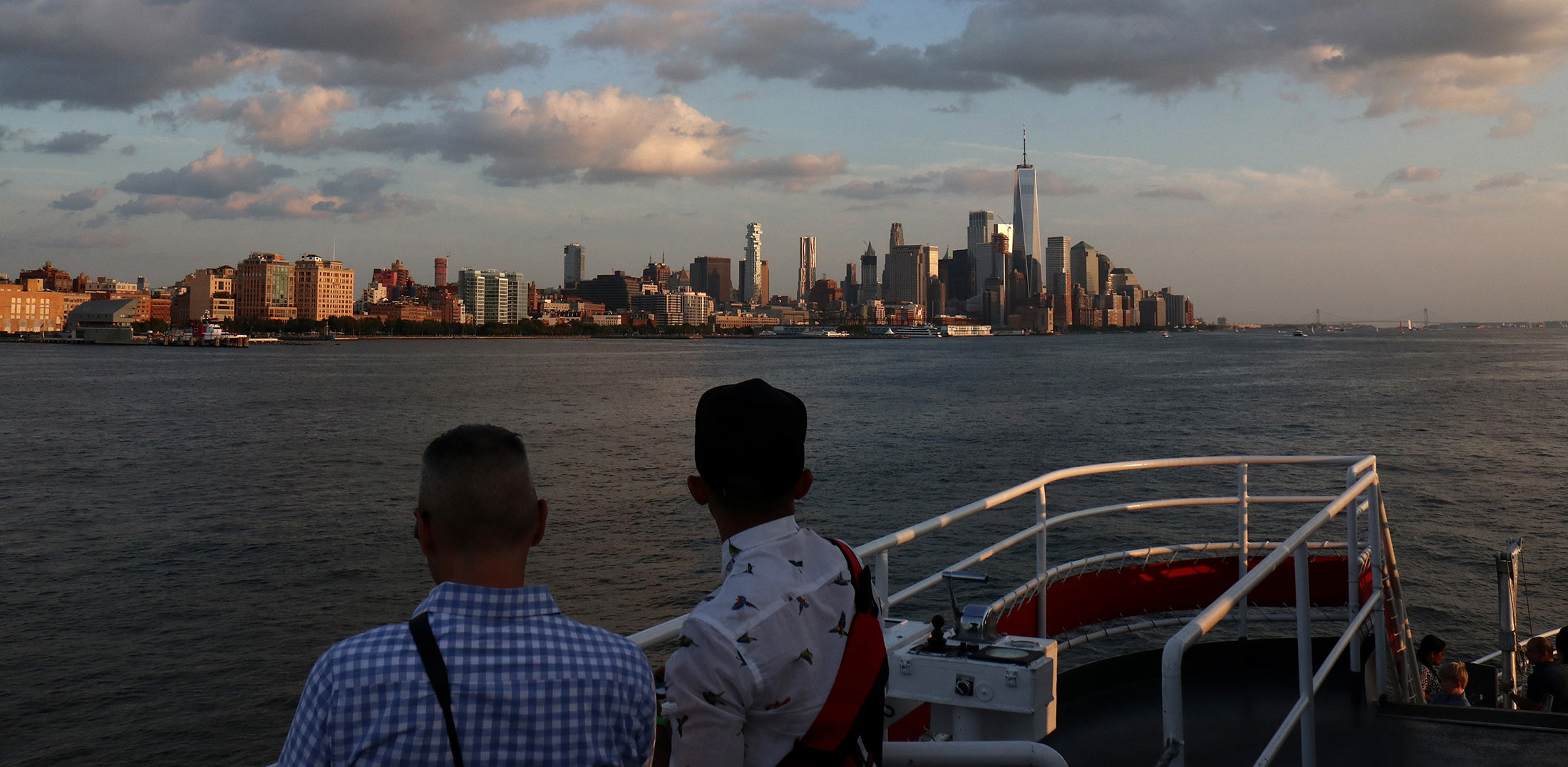 A cruise on the Hudson River as sunset falls on lower Manhattan.