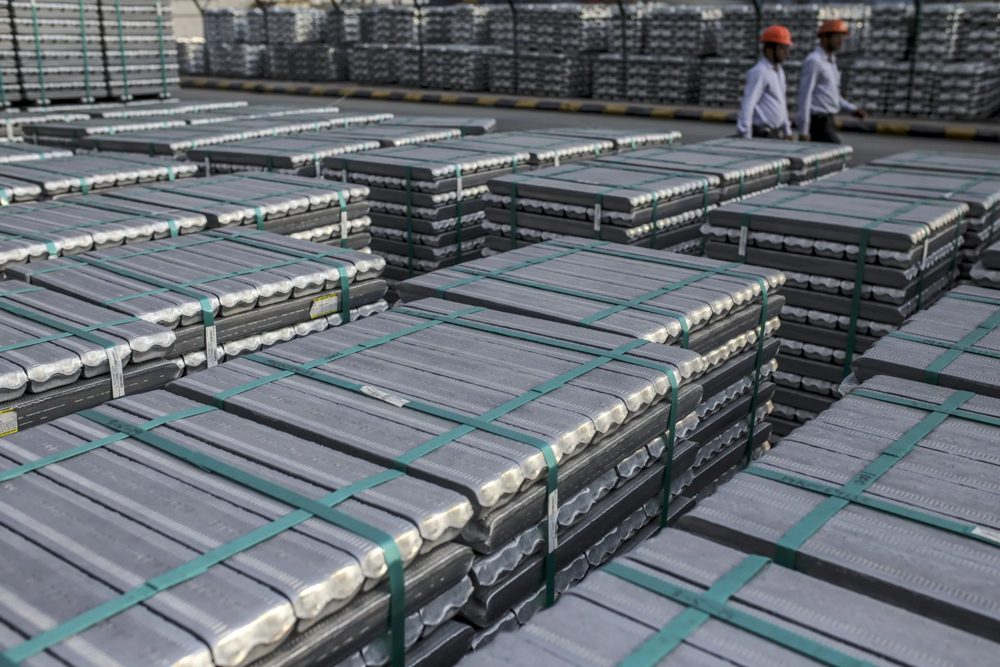 Bound aluminium ingots sit stacked outside the cast house unit of the Vedanta Ltd. Aluminium Smelter in Jharuguda district, Odisha, India