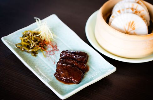 Wagyu beef bun is served with salted cabbage. It's good but not worth the extra cost of the luxury meat.