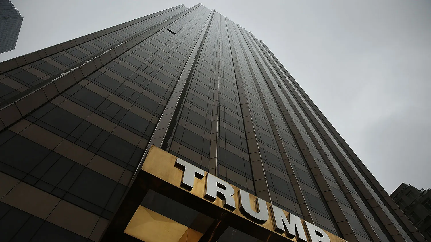 A Trump-owned hotel stands in Manhattan as protesters rally in front of it on May 6, 2016, in New York City.
