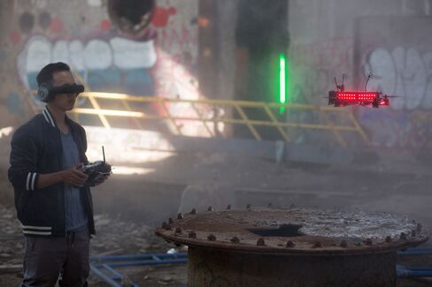 Pilot Ummagawd flies a drone at a Drone Racing League test event at an abandoned New York power plant.