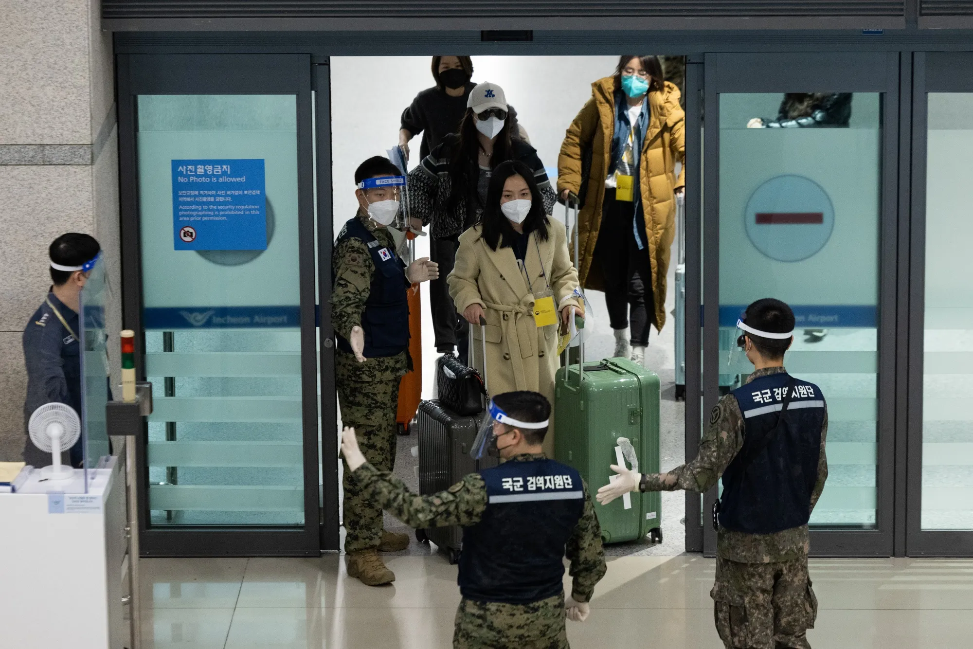 Travelers from China arrive at a gate at Incheon International Airport in Incheon, South Korea, on&nbsp;Jan. 6.