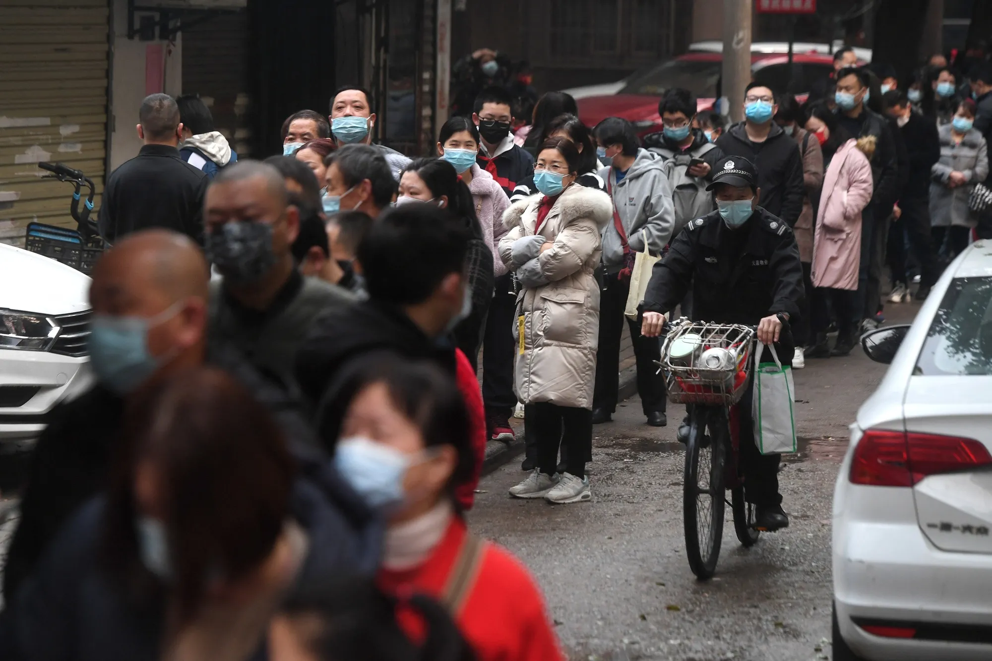 Residents in Wuhan line up for Covid-19 testing on March 4.