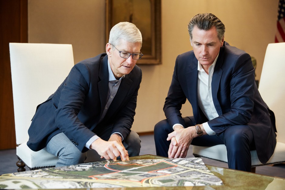 Apple CEO Tim Cook (left) and California Governor Gavin Newsom look at a map of San Jose, where the company has pledged a $300 million plot of land to affordable housing.