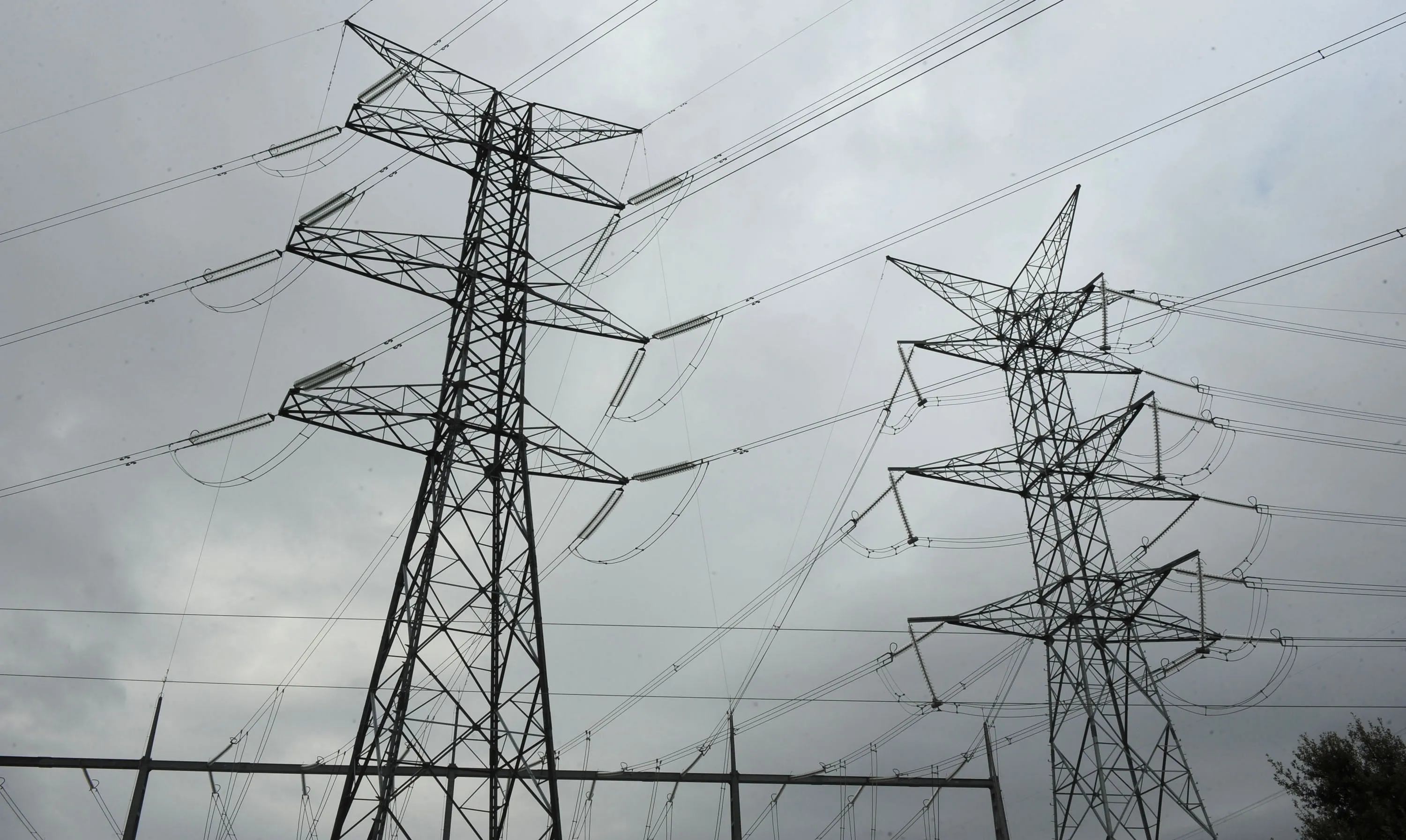 Power transmission lines are suspended from electricity pylons in Madrid.