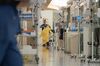 A healthcare worker wears a protective gown at the Covid-19 intensive care unit at a hospital in San Diego, Calif., Jan. 28.