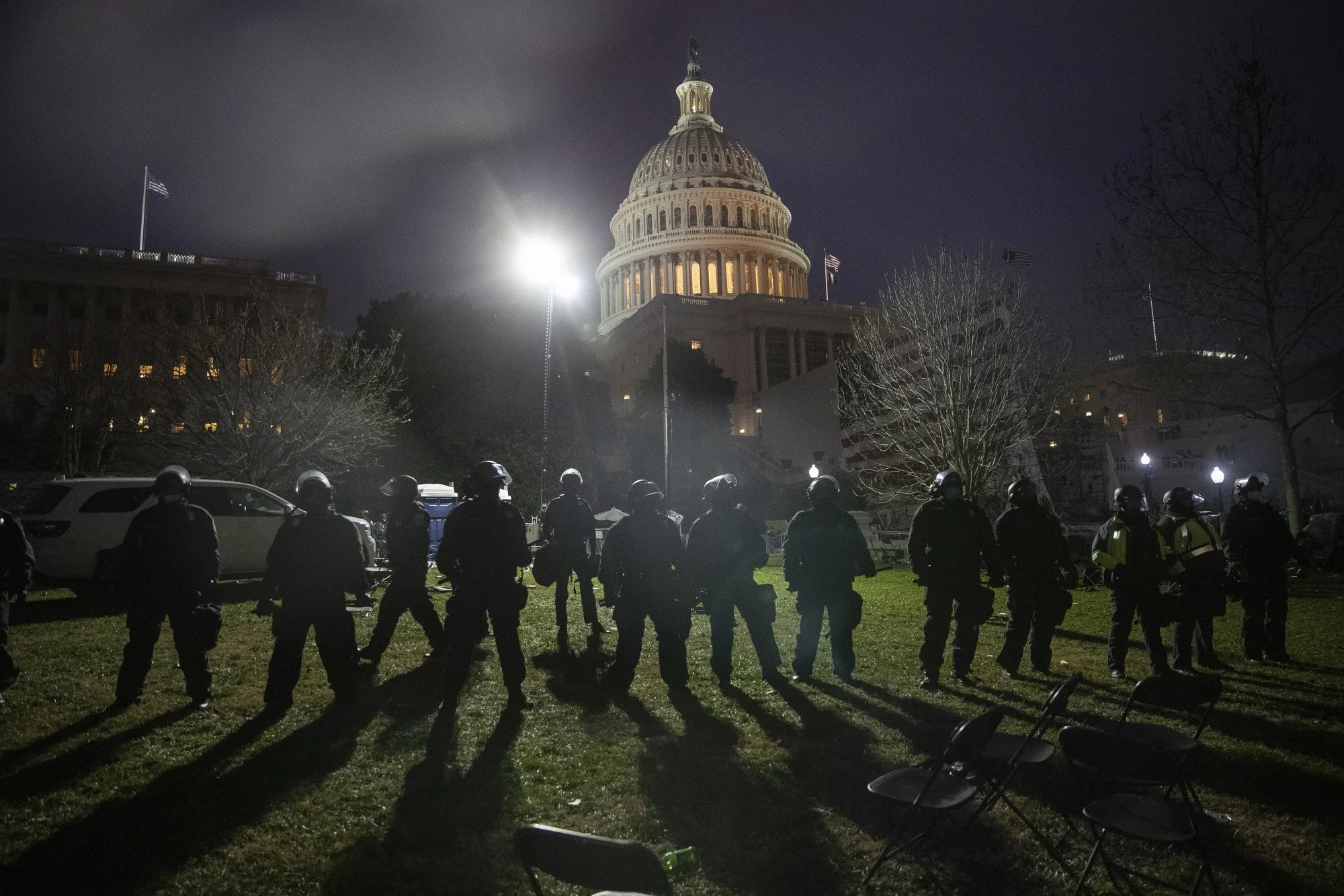 Law enforcement officers guard the U.S. Capitol building after demonstrators earlier stormed the building in Washington, D.C., on Jan. 6.