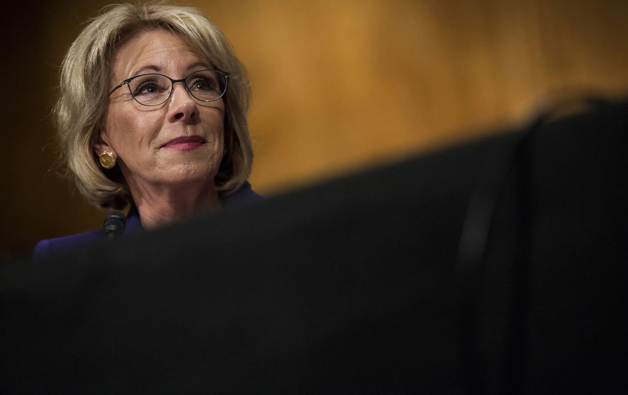 Betsy DeVos, secretary of education nominee, listens during a Senate Health, Education, and Labor Committee confirmation hearing in Washington on Jan. 17, 2017.
