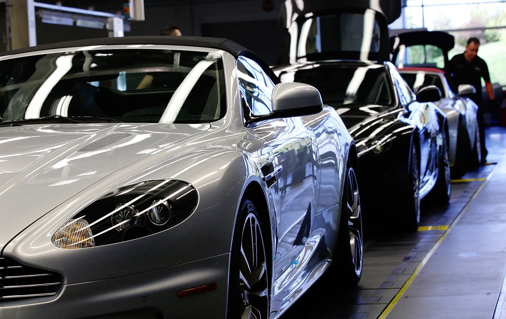 Completed Aston Martin vehicles sit on the production line at the Aston Martin Lagonda Ltd. factory in Gaydon, U.K.