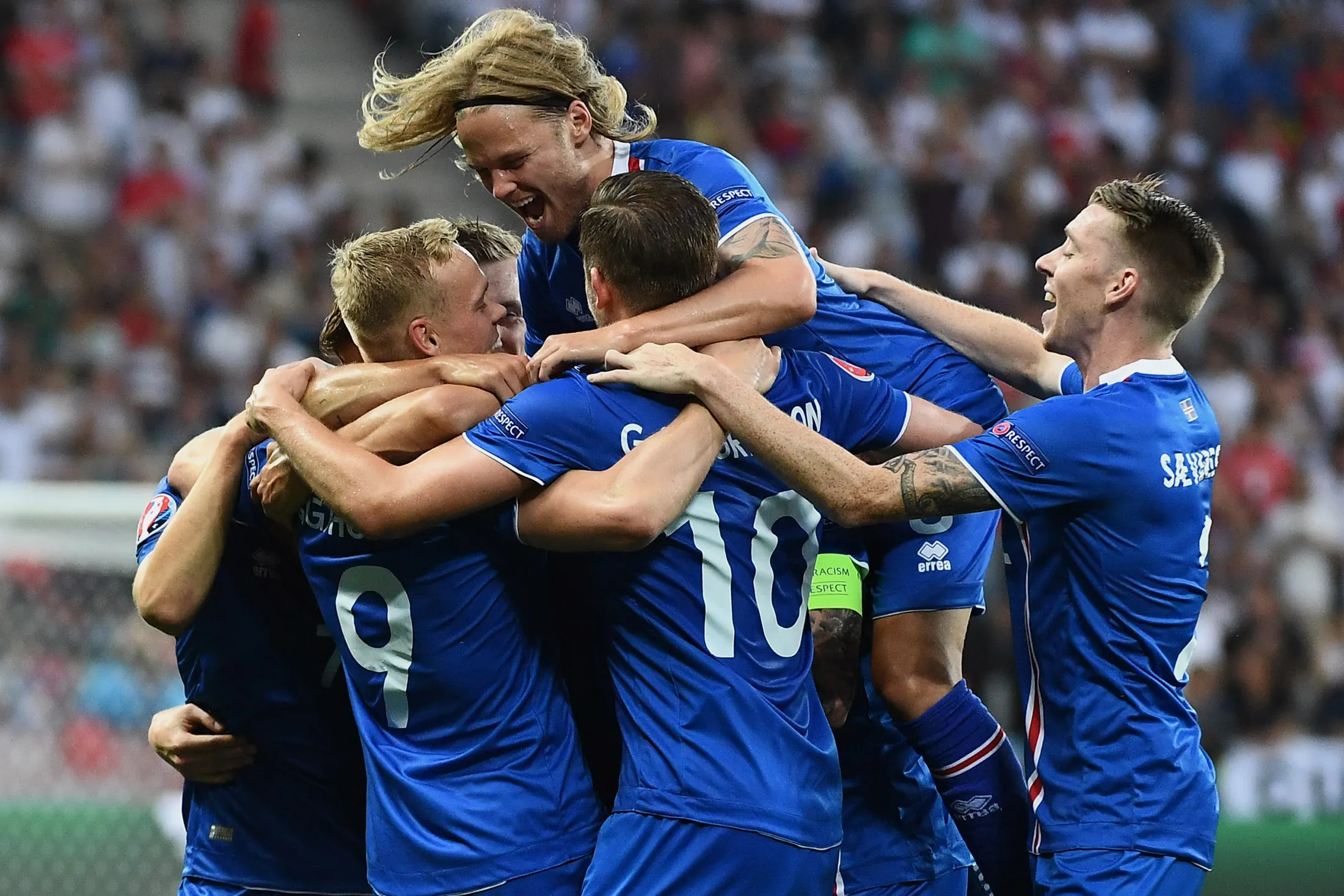 Iceland's forward Kolbeinn Sigthorsson (L) celebrates with teammates after scoring the 1-2 during Euro 2016 round of 16 football match between England and Iceland at the Allianz Riviera stadium in Nice on June 27, 2016.
