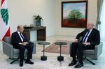 Michel Aoun, left, meets with Najib Mikati at the presidential palace in Baabda, Lebanon, on July 26.