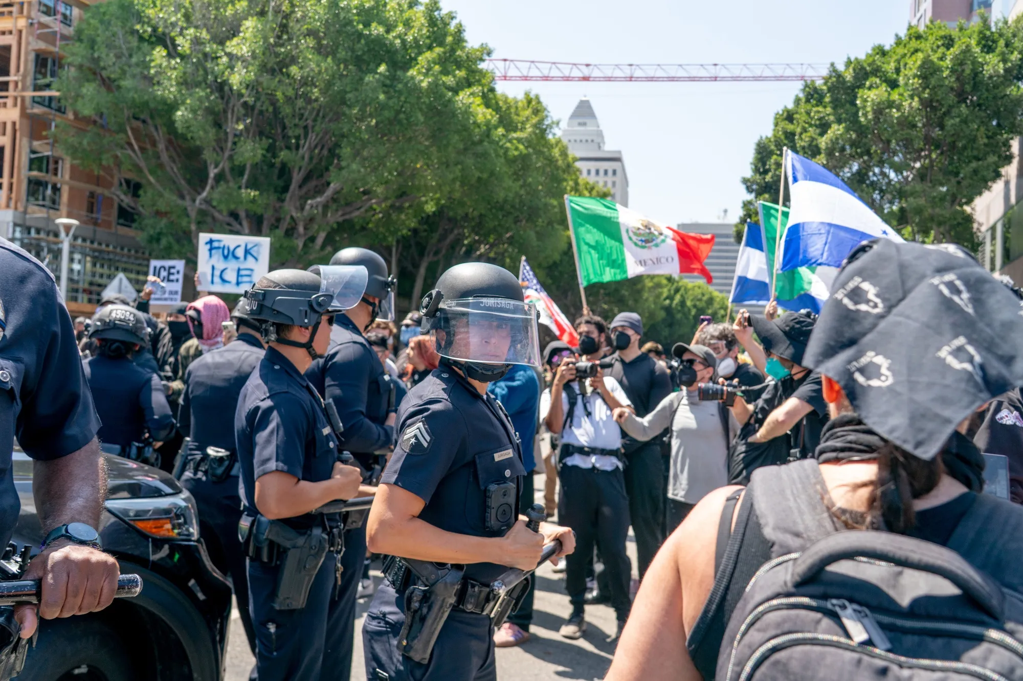 Protesters confront law enforcement officers outside the Edward R. Roybal Federal Building in Los Angeles&nbsp;on June 8, 2025.