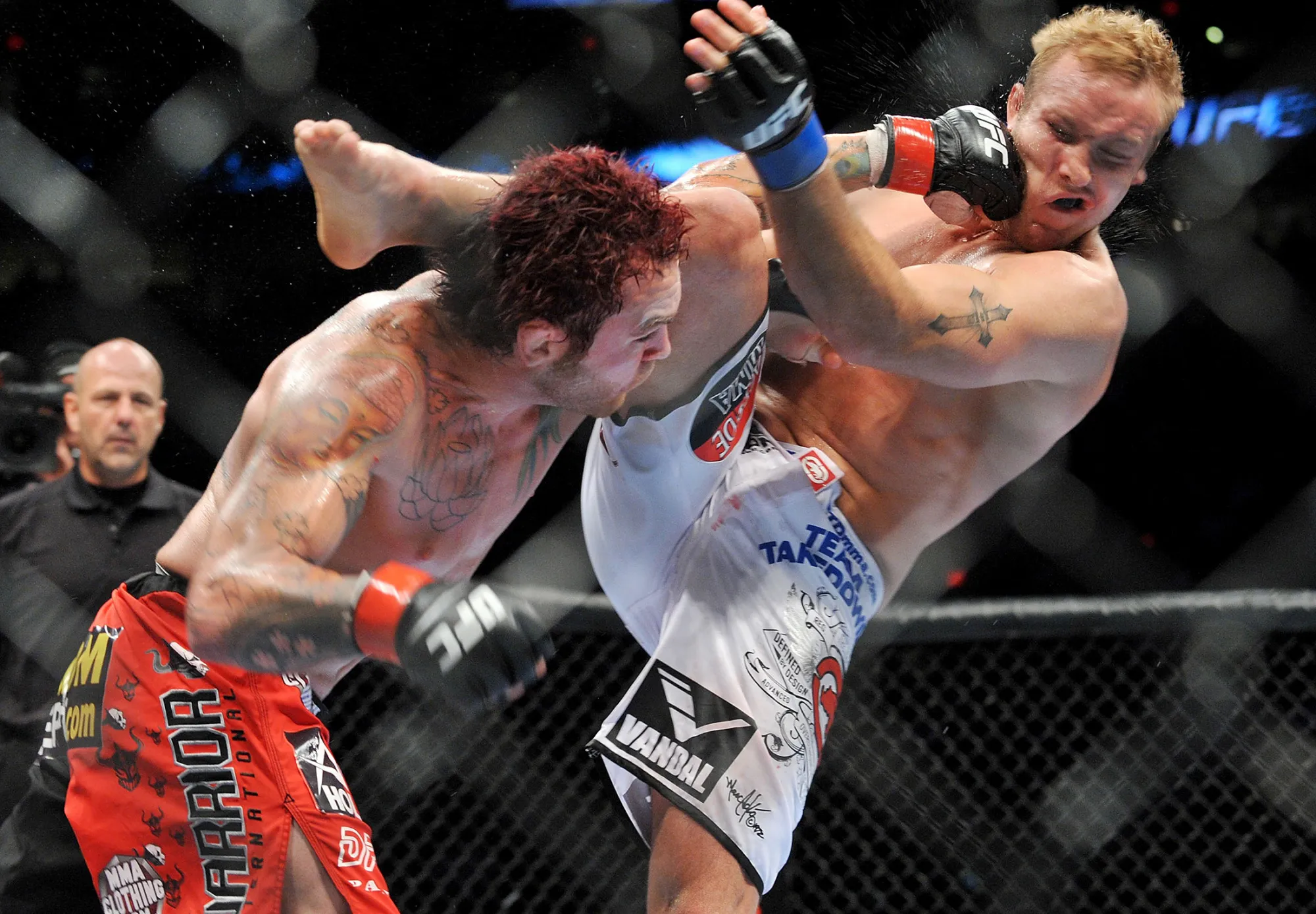 UFC fighter Chris Leben, left, battles UFC fighter Jake Rosholt during their bout at the Rose Garden Arena in Portland, Oregon, on August 29, 2009.
