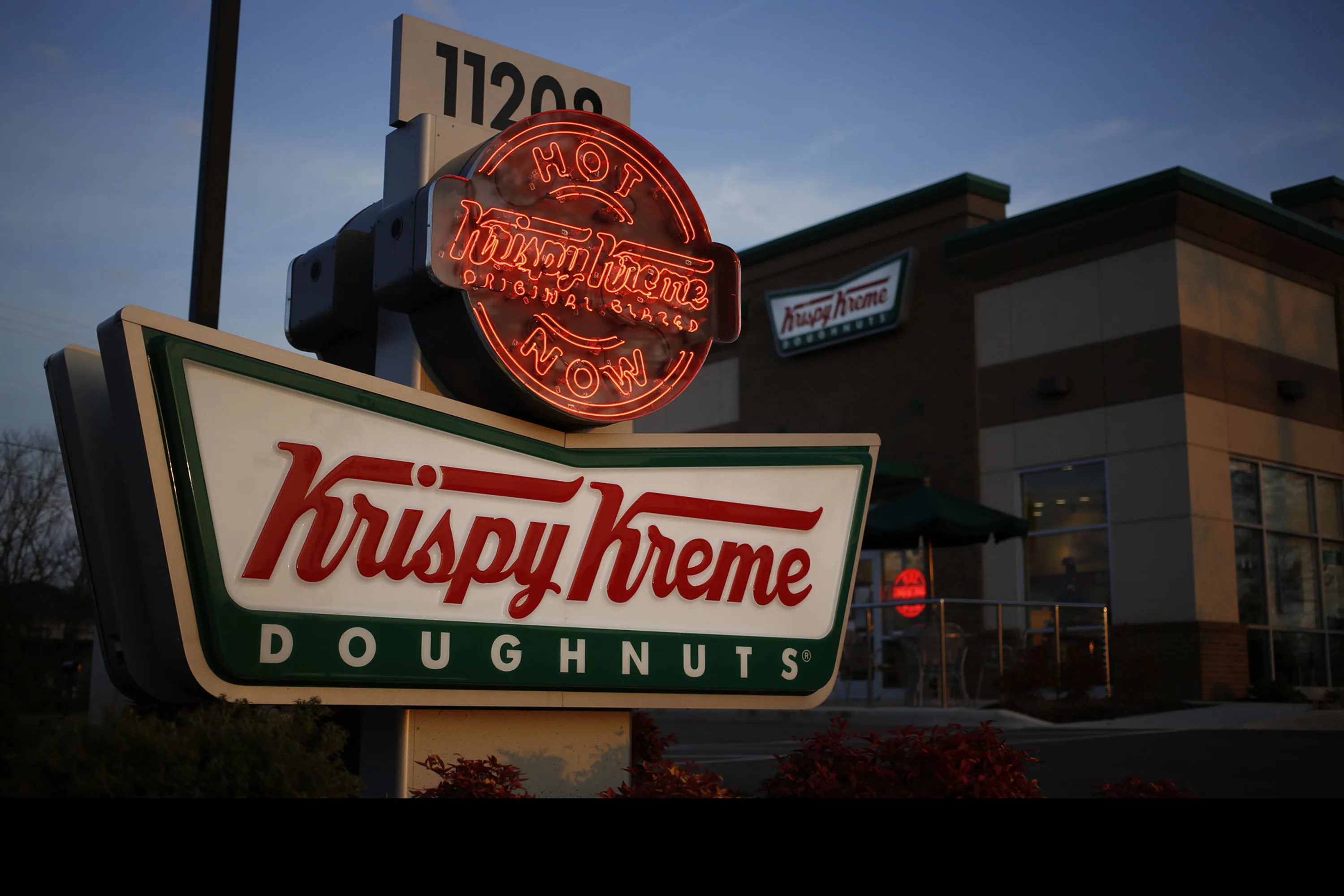 Krispy Kreme, looking to get more respect for its coffee, has begun calling workers 'baristas' at one test location.
