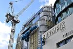 Contractors work on the redevelopment of the London Olympia Exhibition Center in West Kensington, London, on March 12.