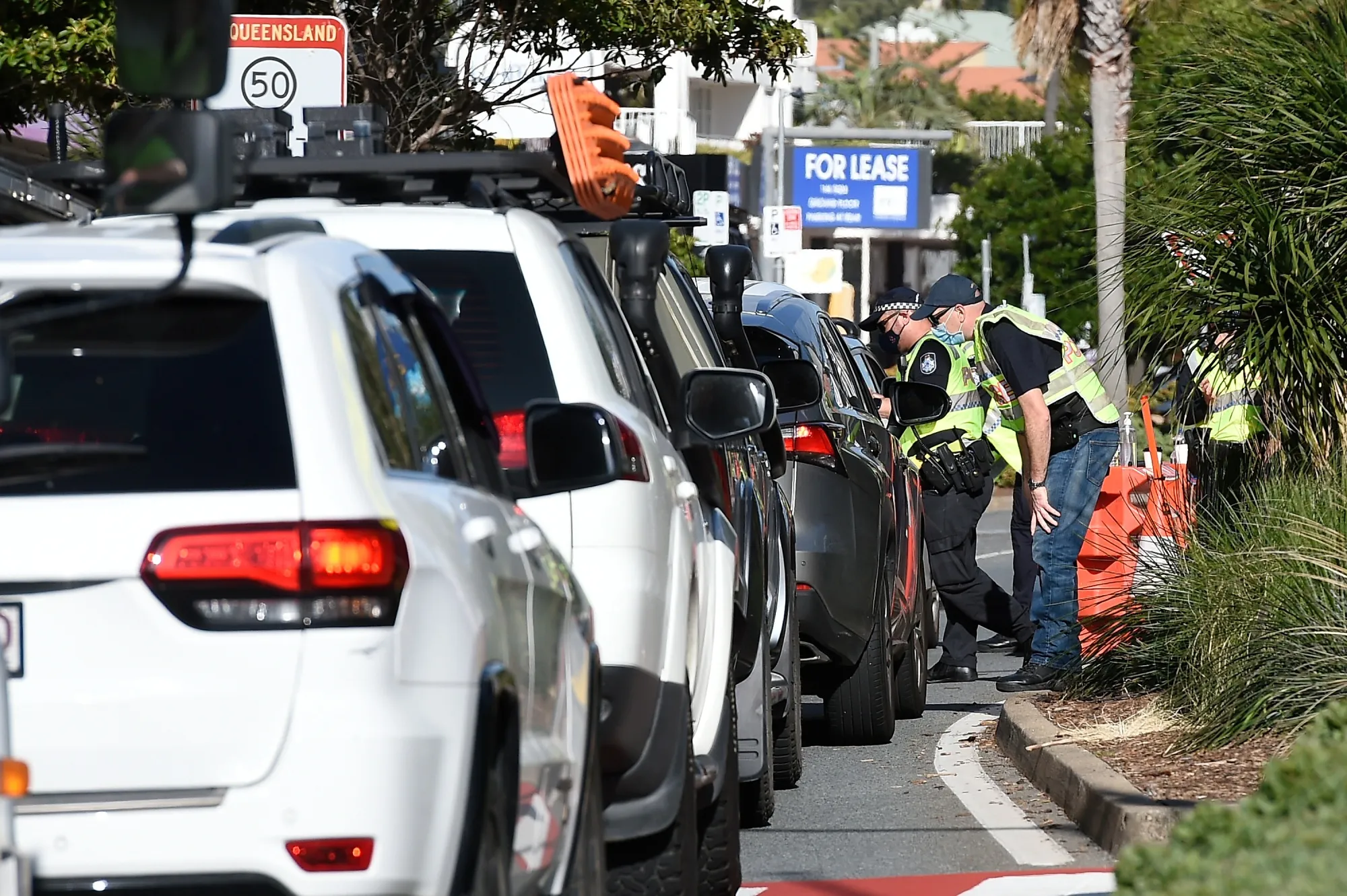 Police officers at the Coolangatta border check point in Gold Coast, Australia, earlier in September.