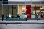 People wearing protective masks wait in line for Covid-19 testing at a CityMD in New York, U.S., on Monday, Nov. 9, 2020.
