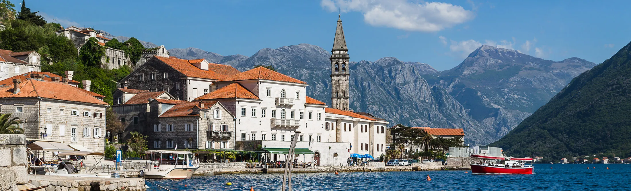 The historic old town of Perast, sandwiched between the turquoise water of the Bay of Kotor and the rugged mountains of&nbsp;Montenegro’s coastline.