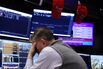 Traders At The New York Stock Exchange As Stocks And Bonds Slide Globally As Oil Tops $100