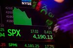 A monitor with stock market information on the floor of the New York Stock Exchange.