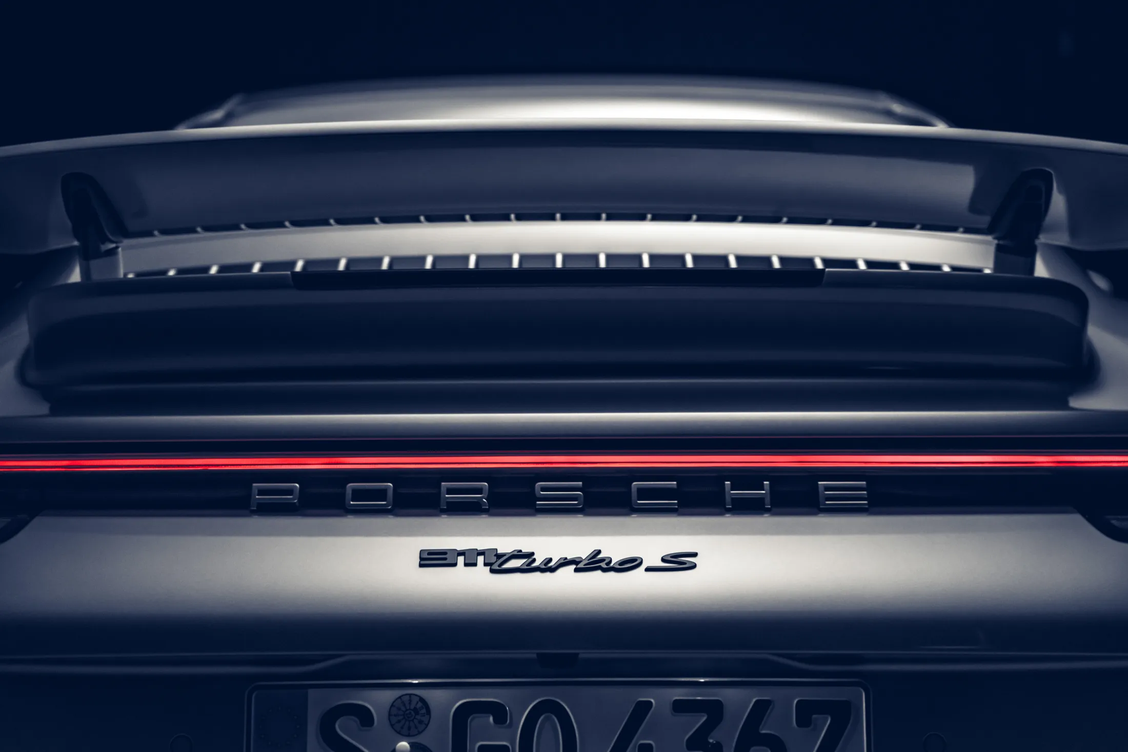 Close-up view of a Porsche 911 Turbo S, suggesting premium detailing and a performance-oriented character.