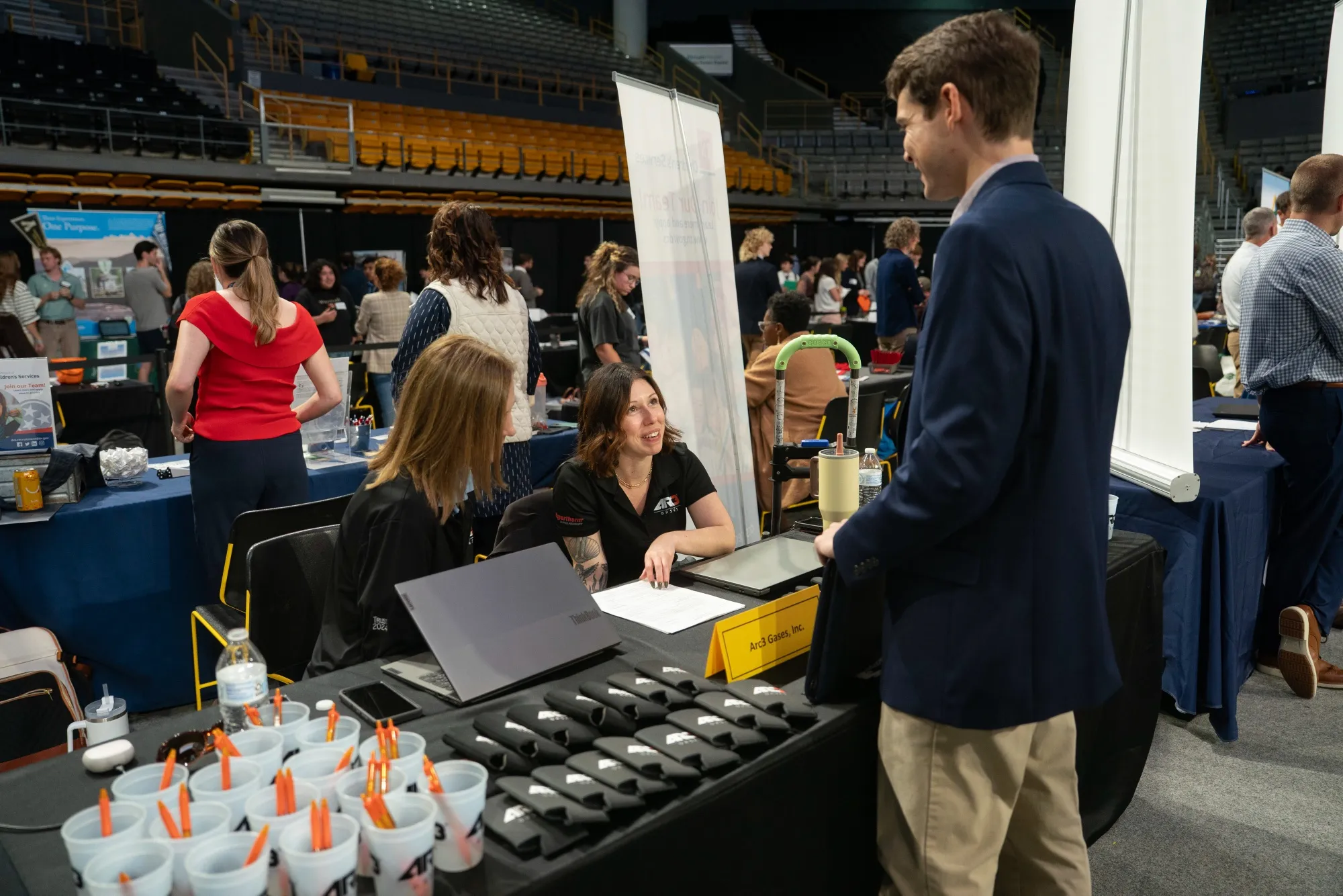Recruiters speak to a job seeker at an&nbsp;internship and job fair in Boone, North Carolina.
