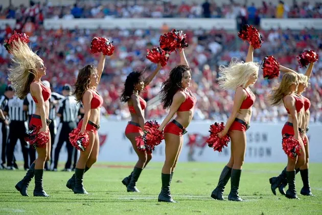 The Tampa Bay Buccaneers cheerleaders perform during an NFL game in Tampa, Florida on Dec. 8, 2013