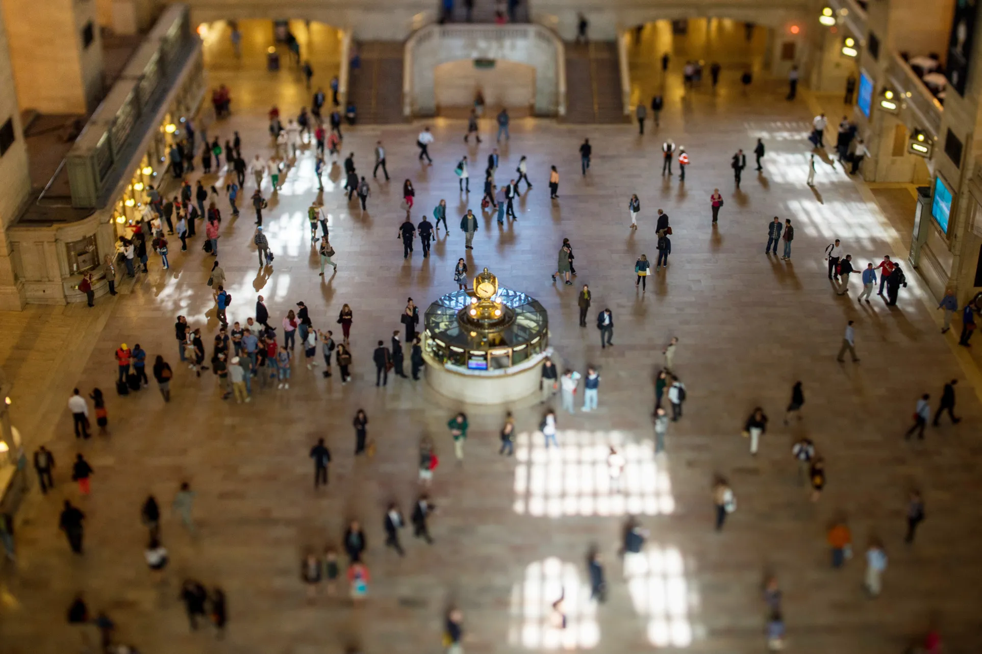 Commuters walk through Grand Central Terminal in this photograph taken with a tilt-shift lens in New York.