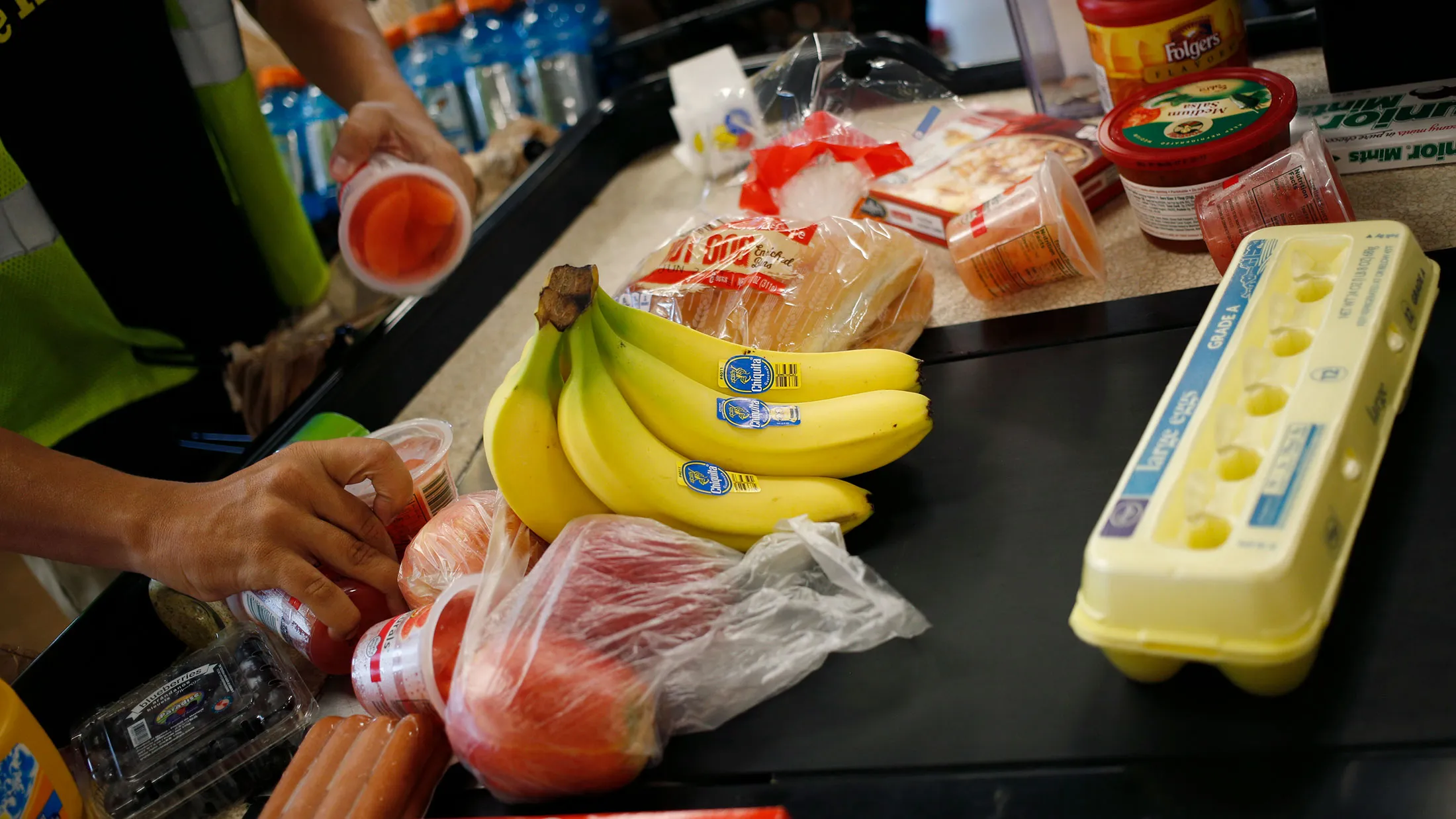An employee bags groceries for a customer at a checkout counter inside a Kroger Co. grocery store in Louisville, Kentucky, on June 14, 2017.
