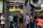People line up outside of a currency exchange house in Buenos Aires, Argentina, on Oct. 25.