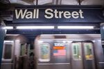 A train departs a Wall Street subway station near the New York Stock Exchange (NYSE) in New York, U.S.