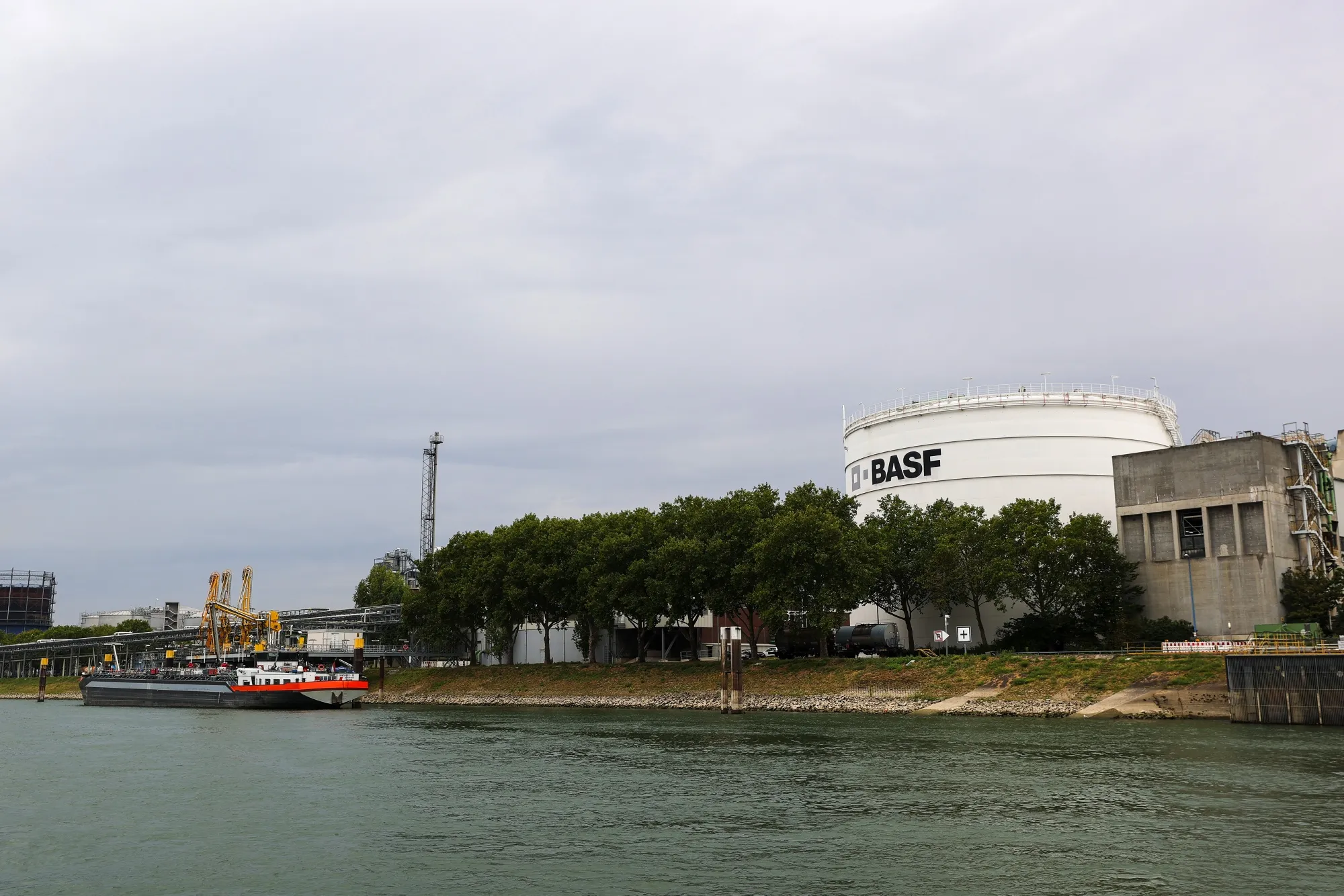A chemical tanker barge sits docked at the BASF SE plant on the River Rhine in Ludwigshafen, Germany