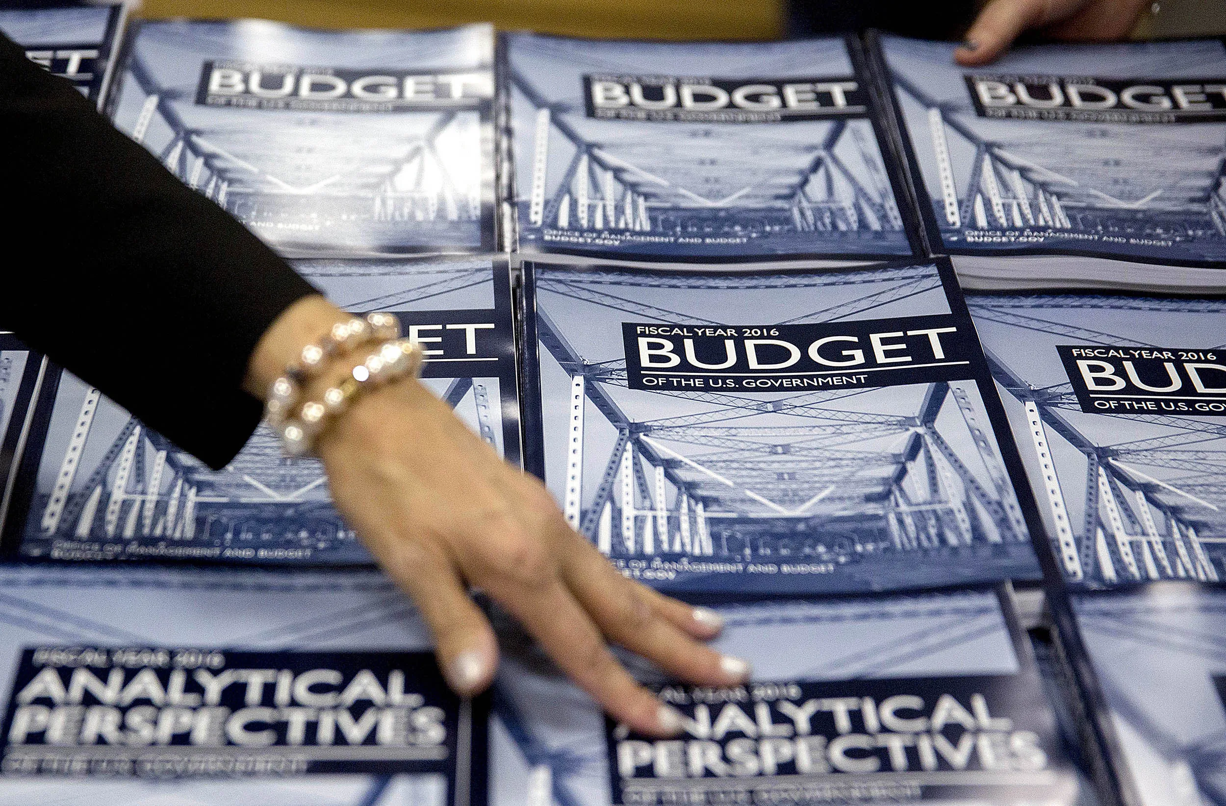 An employee arranges copies of U.S. President Barack Obama's Fiscal Year 2016 Budget on display at the U.S. Government Publishing Office (GPO) in Washington, D.C. on Feb. 2, 2015.
