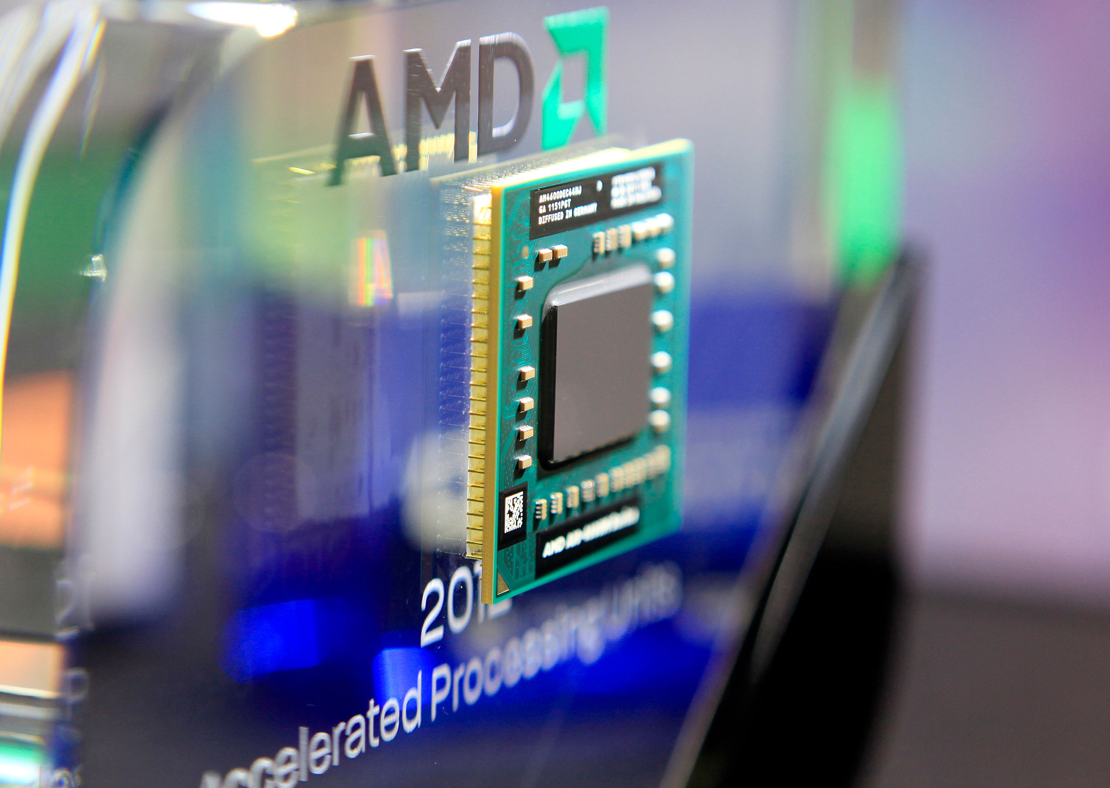 Advanced Micro Devices Inc. tumbled 13 percent in early New York trading after the chipmaker said second-quarter sales declined more than it had originally projected, citing weak consumer demand for personal computers.
