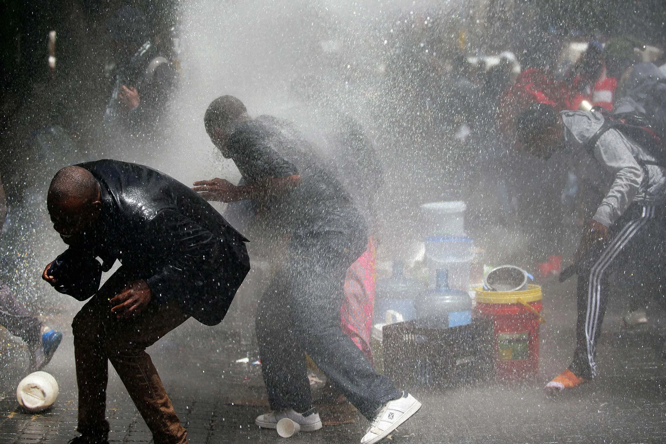 Police fire a water cannon during a protest against xenophobia in Cape Town&nbsp;on Oct. 30.