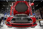 A view of a fully electric Tesla car on an assembly line at the new Tesla Motors car factory.