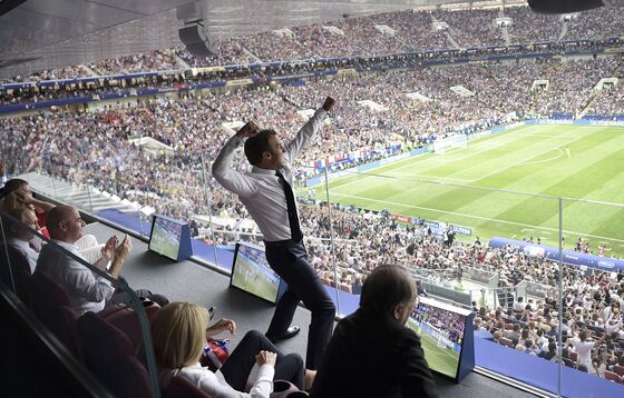 Macron, Paris Fans Greet French National Soccer Team Winners