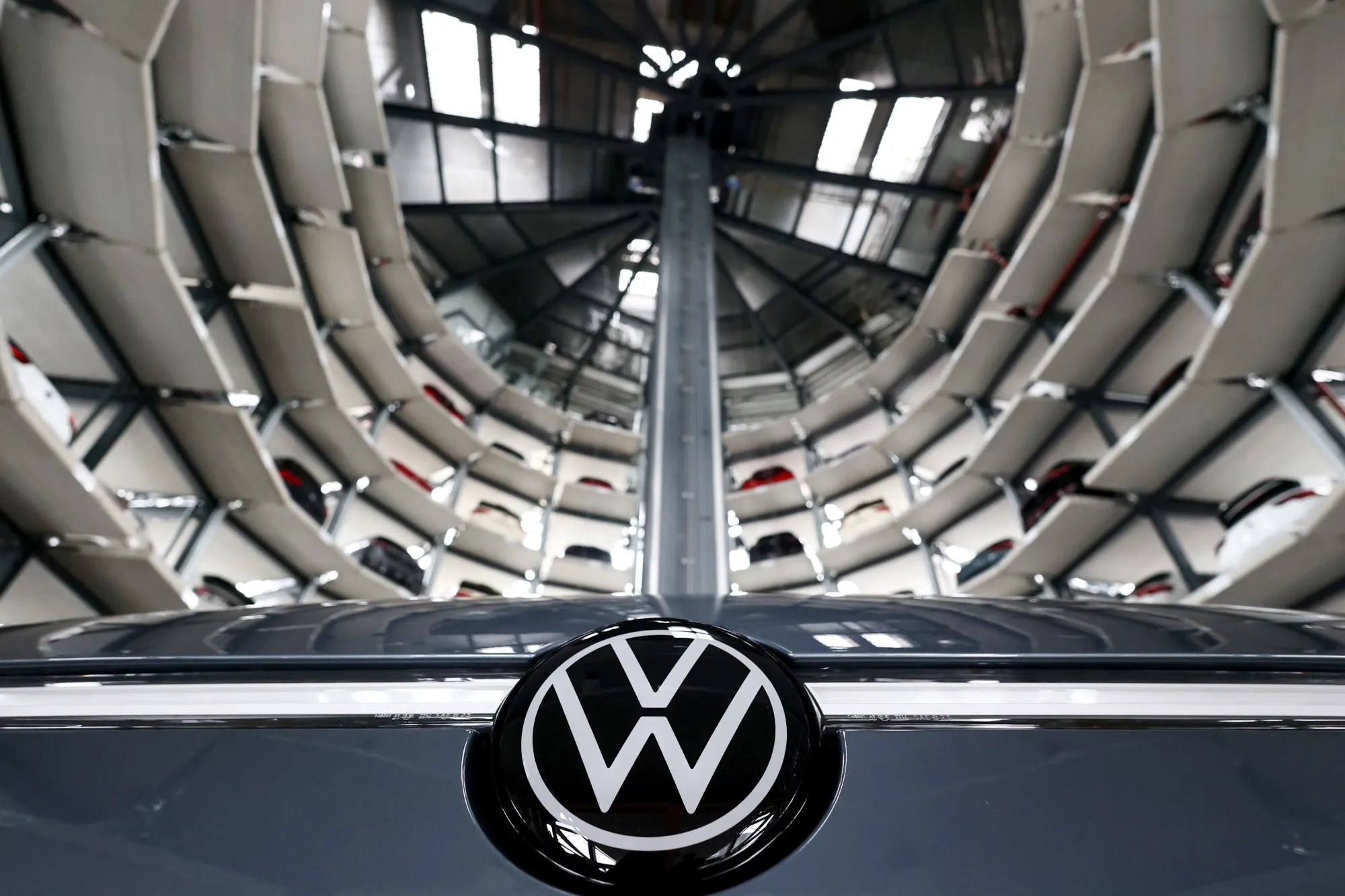 A VW ID.7 electric automobile inside an Autostadt Car Tower at the Volkswagen AG headquarters and auto plant complex in Wolfsburg, Germany, on Friday, Nov. 15, 2024. VW laid out cost-savings proposals to workers that would shore up its financial position while potentially avoiding factory closures in Germany.