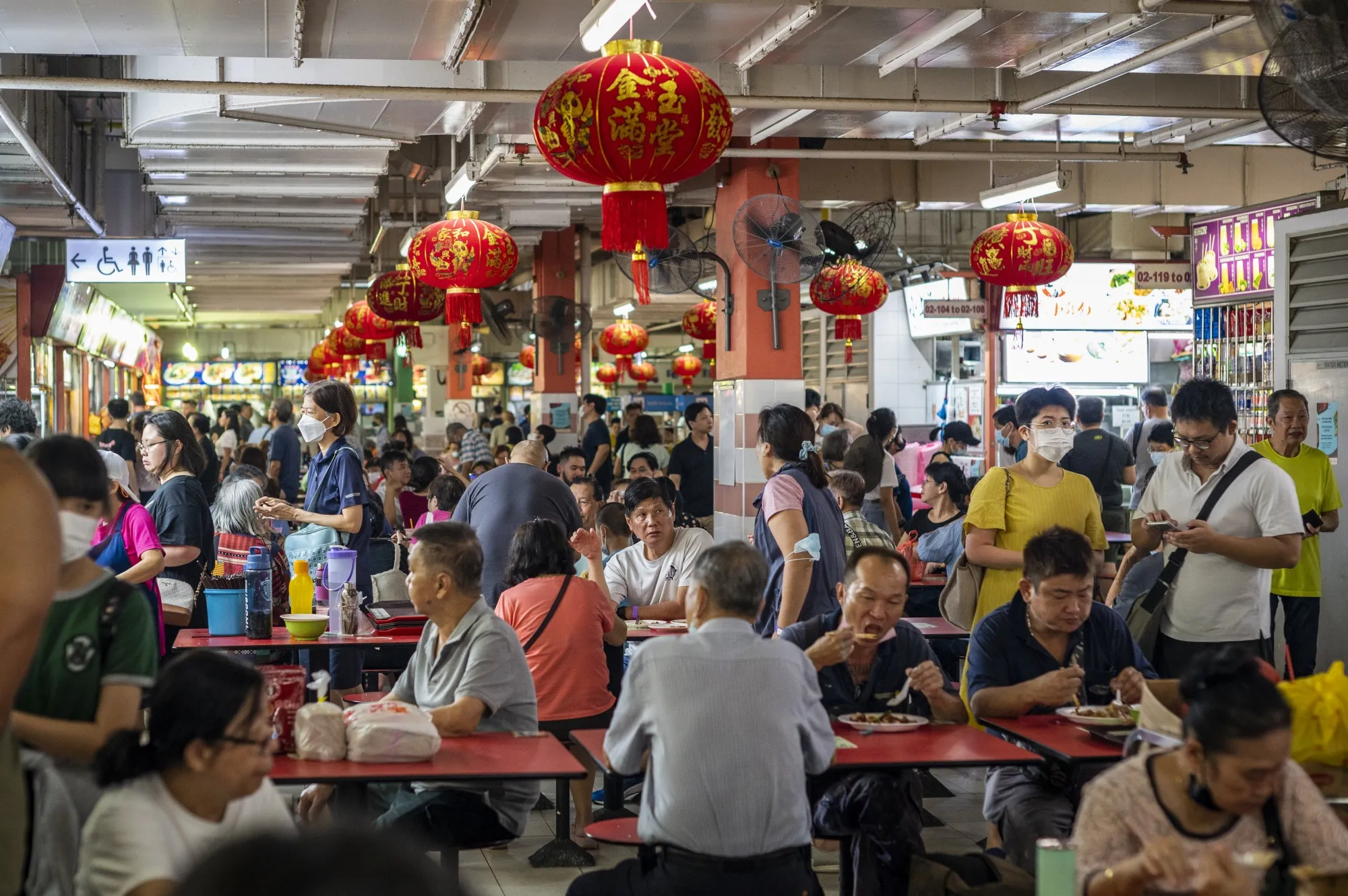 Customers have lunch at Chinatown Complex Food Centre in Singapore.