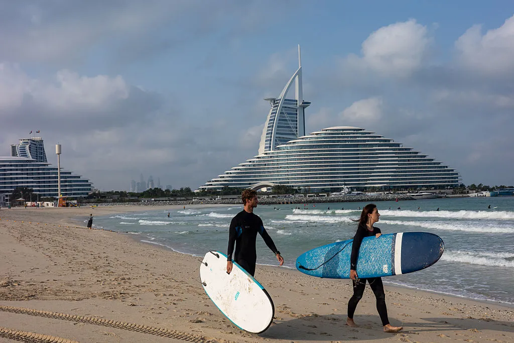 Surfers on Jumeirah Beach, on March 05, 2026.