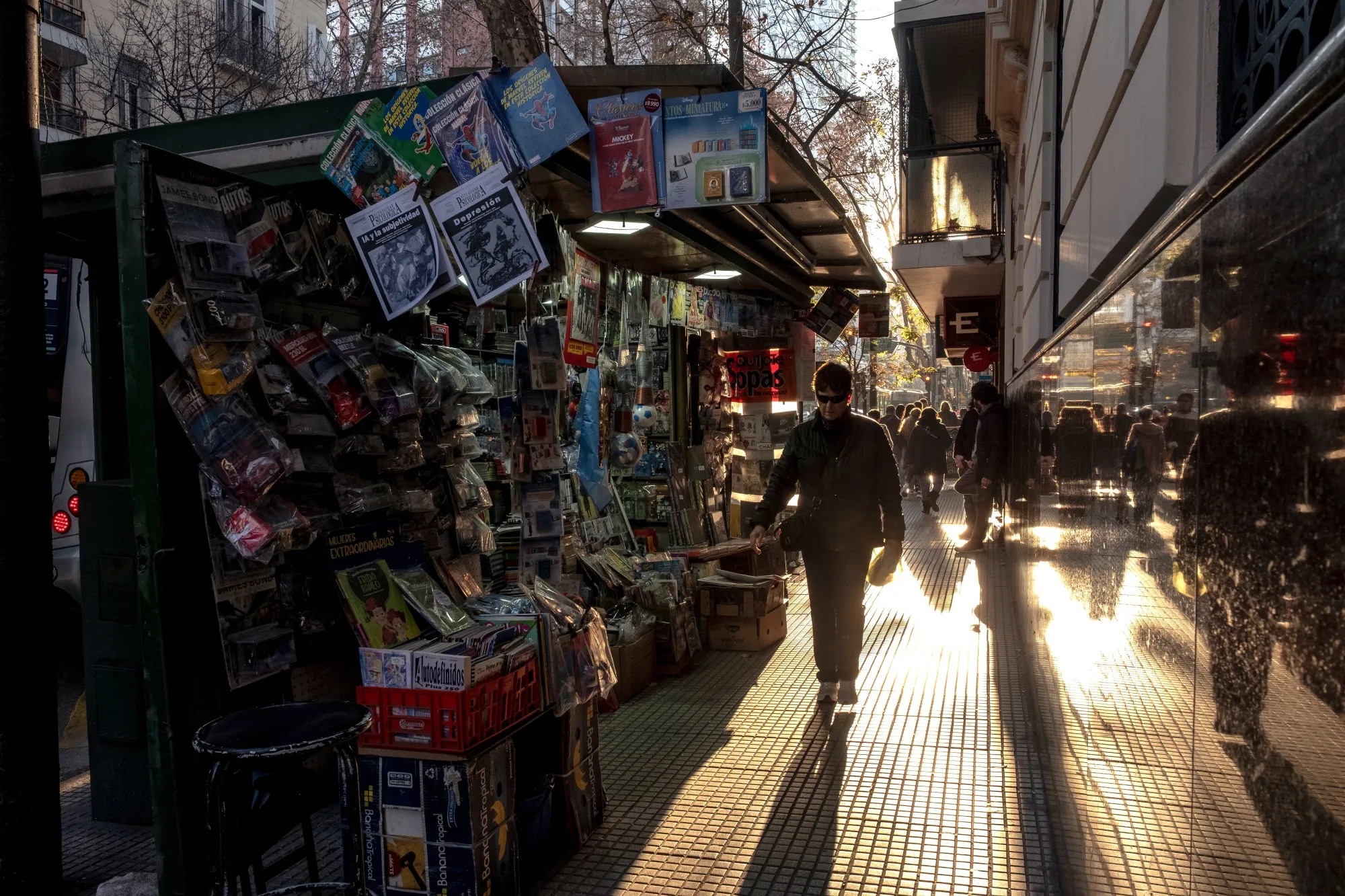 Pedestrians walk past a newsstand in Buenos Aires, Argentina, on&nbsp;July 12.